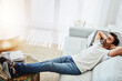 © peopleimages.com - Relax, man and sleeping on sofa for resting, peaceful and weekend break in living room. Leisure, lazy Sunday and male person with arms out on couch for lying, dreaming or chill day off in home