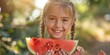 Summer Joy: Young Girl Smiling While Eating Watermelon