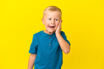 Wall Mural - Little Russian boy isolated on yellow background with surprise and shocked facial expression