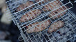 grilling lamb kebabs on a grill