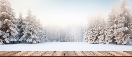 Poster - Winter forest with snow and tall pine trees displaying an empty wooden table A scenic Christmas or winter backdrop with ample copy space ideal for product display templates