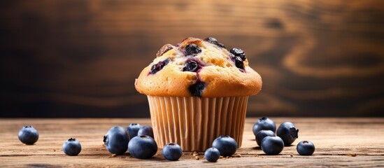 Poster - A delicious blueberry muffin made with oats is displayed on a wooden background ready to be baked The image provides ample space for copy