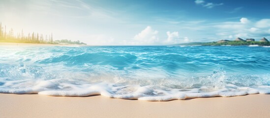 Poster - Abstract background with a blurred tropical beach and bokeh sunlight waves providing ample copy space for an image