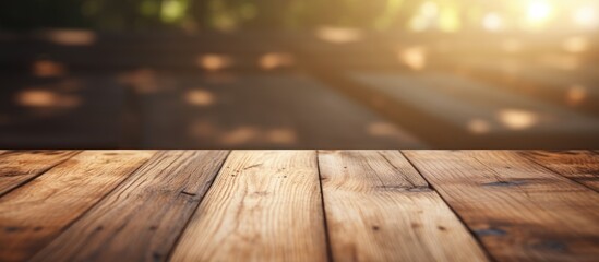 Poster - Wooden background with a blurry surface showcasing natural lighting and shadow This copy space image represents the concept of a wooden background