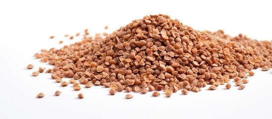 Poster - A bunch of healthy dried buckwheat grains on a white background with ample copy space in the image