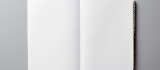 Fototapete - A white notebook captured in a studio setting providing ample copy space for creative purposes