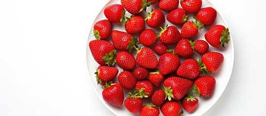 Aufkleber - A close up view from above of a plate containing fresh and healthy strawberries The plate is isolated on a white background offering copy space for text
