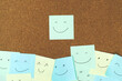 collection of colorful variety post note. paper note reminder sticky notes pin paper blue  on cork bulletin board. empty space for text.