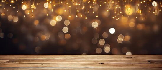 During Christmas time a copy space image shows rice lights twinkling on a wooden plank