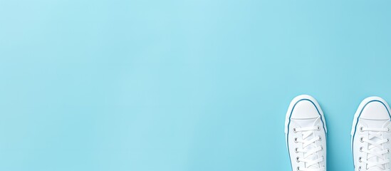 Poster - Trendy feminine background with pale white female shoes on a blue backdrop Top view with a flat lay perfect for beauty blog fashion concept Copy space image
