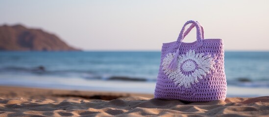 High quality photo of a crocheted lilac and white jute beach bag with copy space image