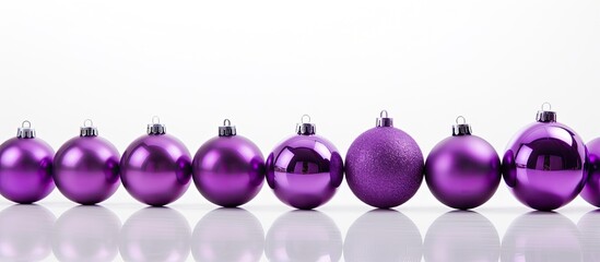 Poster - A copy space image featuring a background of violet Christmas balls creating a festive and isolated photo on a white background