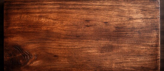 Leinwandbilder - A copy space image featuring a textured wooden surface in brown color It serves as a cutting board for cooking purposes