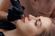 Process permanent tattoo red pigment makeup for lip of woman