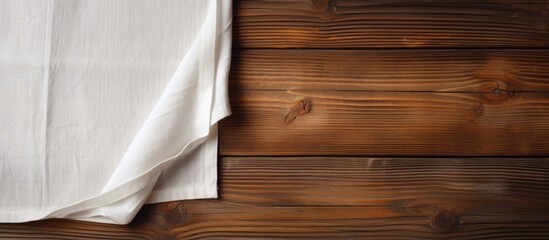 Aufkleber - Copy space image of a cloth napkin resting on a rustic wooden surface creating an inviting backdrop for adding text or messages