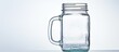 © HN Works - A vintage mason jar is displayed on a white background featuring a lid and handle The image includes a reflection and has ample copy space