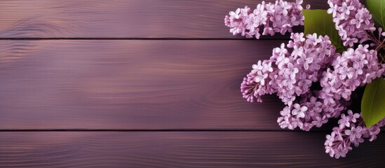 Poster - A lilac branch placed on a wooden surface creating a serene and elegant copy space image