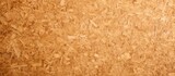 Fototapeta Dinusie - MDF particle board with a wood texture makes for an ideal background featuring ample copy space