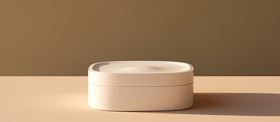Poster - Mock up plastic container for cream gel or lotion with hard shadows on a beige background Beauty product package in a monochrome top view copy space image