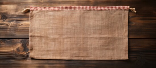 Aufkleber - Wooden cutting board with a kitchen cloth placed on a wood background creating an empty space for an image. Creative banner. Copyspace image