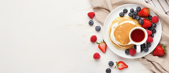 Wall Mural - A romantic Valentine s Day breakfast concept with heart shaped pancakes fresh berries a cup of coffee and a rose on a white bed Top view copy space image