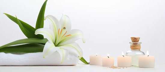 Aufkleber - A serene wellness setting showcases a beautiful lily a towel a candle and an oil bottle on a white background providing ample copy space for your own use