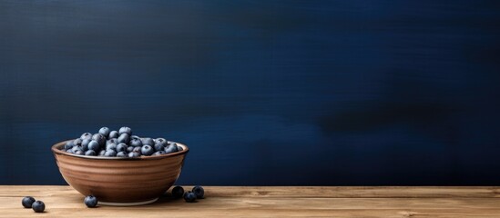 Poster - A rustic country table showcases a captivating image of a blueberry nestled in a bowl leaving ample copy space for creative use