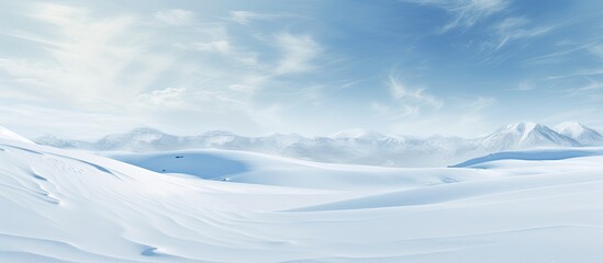 Poster - Winter landscape with snowy ground and wind sculpted patterns on the snow surface creating a wide panoramic background The natural snow texture adds to the beauty of the copy space image