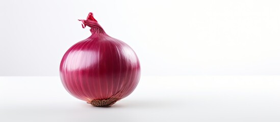 Poster - A red onion stands alone on a white background in this copy space image