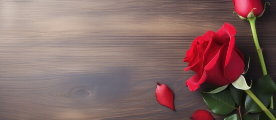 Poster - A top down view of a Valentine s Day composition featuring a rose flower and a red heart placed on a table with empty space for text or images The image conveys a holiday theme. Creative banner