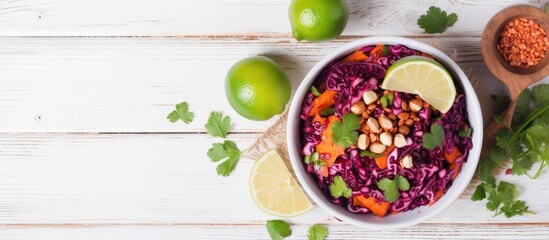 Poster - Top view of a detox salad made with red cabbage carrots and pomegranate accompanied by a flavorful cilantro dressing Presented on a white wooden background with ample space for copy