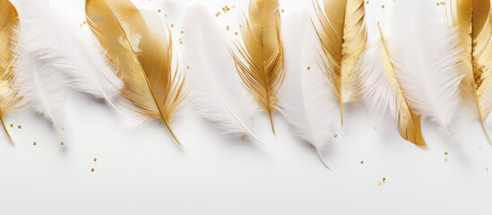 Aufkleber - Top view of white feathers with a radiant gold glitter on a white background creating a visually appealing flat lay image with ample copy space