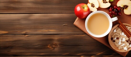 Aufkleber - Top view of a healthy breakfast featuring a plate of oat flakes topped with honey milk apple slices cinnamon toast and currants The image includes a wooden table as a background. Creative banner
