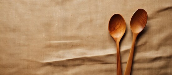 Aufkleber - Top view of a copy space image featuring a wooden spoon and fork placed on a background of sackcloth