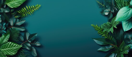 Poster - Top view of a trendy green and turquoise background with a creative layout of green leaves and exotic wild plants Perfect for summer spring or ecology themed copy space images