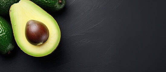 Poster - A top view of a whole avocado on a light background with a frame that provides space for text. Creative banner. Copyspace image