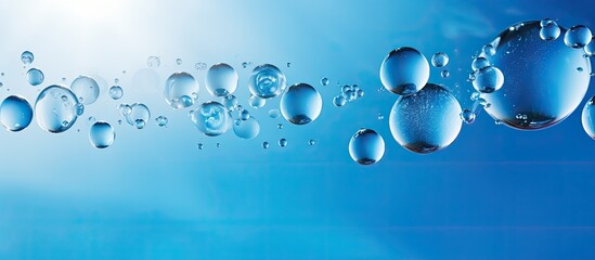 Poster - A vibrant macro abstract image showcases round bubbles of carbon dioxide floating in the translucent blue waters of the ocean providing ample copy space