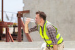 © JU.STOCKER - Worker man in hardhat drinking water at container cargo, Engineer man drinking water at the precast factory site