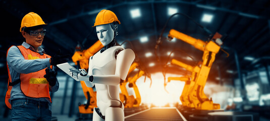 Wall Mural - MLP Mechanized industry robot and human worker working together in future factory. Concept of artificial intelligence for industrial revolution and automation manufacturing process.