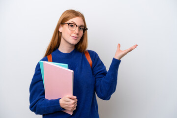 Poster - Young student redhead woman isolated on white background extending hands to the side for inviting to come