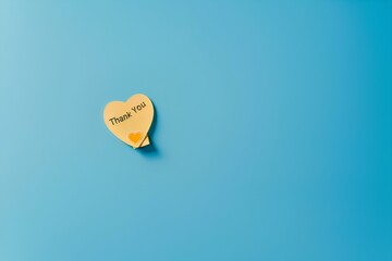 Wall Mural - A minimalist composition featuring a single yellow heart-shaped post-it note with a bold 
