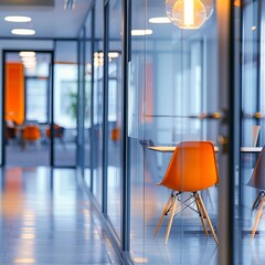 Wall Mural - Close-up of a modern office setting featuring an orange chair against a backdrop of glass panels and reflecting lights