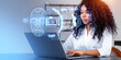 © ImageFlow - Black businesswoman using laptop, biometric scanning and face id hologram