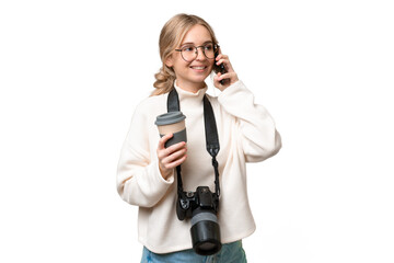 Sticker - Young photographer English woman over isolated background holding coffee to take away and a mobile