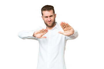 Poster - Young handsome blonde man over isolated chroma key background nervous stretching hands to the front