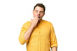 © luismolinero - Brazilian man over isolated chroma key background yawning and covering wide open mouth with hand