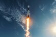 © Elmira - A SpaceX Falcon rocket is blasting off with fiery propulsion against a clear blue sky