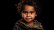 Portrait of indigenous Australian child on black background