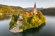 Small island with a Pilgrimage Church on the Bled lake at sunrise in Slovenia