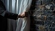 © Ева Поликарпова - A man in a suit opening a curtain, suitable for business concepts
